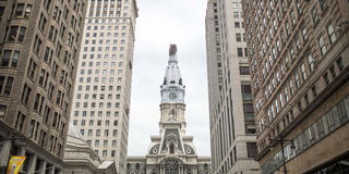philadephia city hall tower surrounded by buildings