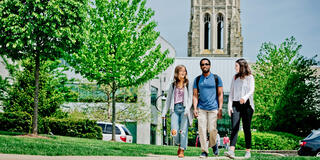 Saint Joseph's University's students walking with Barbelin in the background.