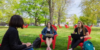 Students and professor outside Maguire Wolfington