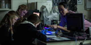 Professor Edwin Li with students in lab