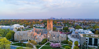 Aerial view of Saint Joseph's University campus with Philadelphia skyline in the background