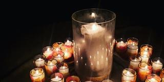 A circle of lit candles