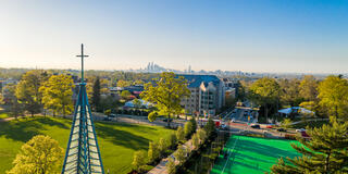 An aerial view of Saint Joseph's University campus with the city of Philadelphia in the distance