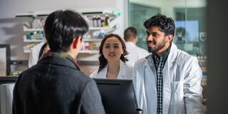 Students helping a simulated patient at the Rite Aid mock pharmacy 
