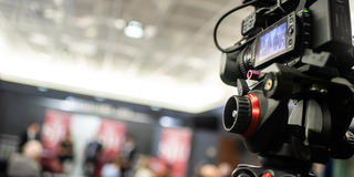Students filming SJU panel event