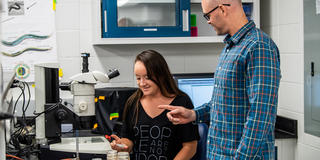 Student and faculty in lab research