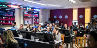 finance students in the wall street trading room at saint joseph's university
