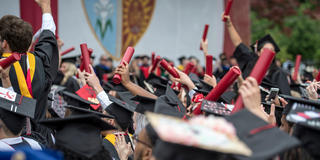 Saint Joseph's University students cheering during the 2023 Commencement ceremony.