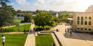 Saint Josephs university library with students walking outdoors