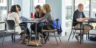 Saint Joseph's University students studying at a table together