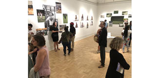 people looking at art