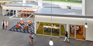 Students at Saint Joseph's University in Lancaster walking through the atrium.