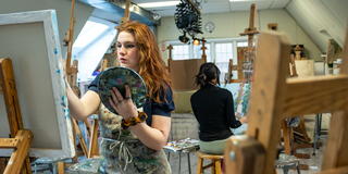 Saint Joseph's University Students working on a art project painting