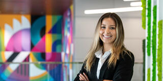 Saint Joseph's University 4+1 graduate student standing with arms crossed smiling