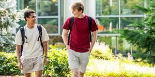 Two male students walking outside