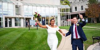 Bride and Groom with hands in the air