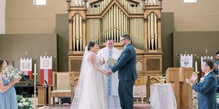 Bride and Groom in front of altar