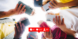 photo of people holding their phones in a circle