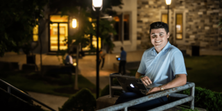 Adult student outside Haub School of Business