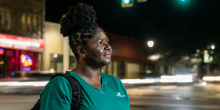 Saint Joseph's adult student waiting for the light