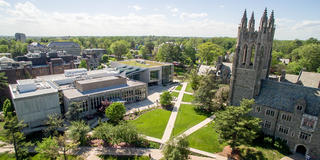 Aerial view of Saint Joseph's University campus with Philadelphia skyline in the background