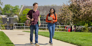 two saint joseph's university students walking on campus