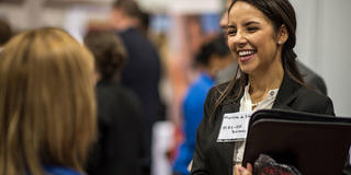 female saint joseph's university student at a career fair event