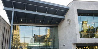 Saint Joseph's University's Barbelin Hall reflecting of Drexel Library's window