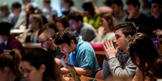 economics students in a lecture hall at saint joseph's university