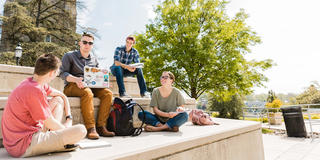 Students sitting outside Drexel Library at Saint Joseph's University