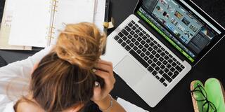 female student looking at a laptop