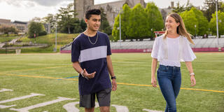 two students walking outside on saint joseph's university's hawk hill campus