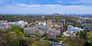 Aerial shot of Saint Joseph's University and the Philadephia skyline during sunset