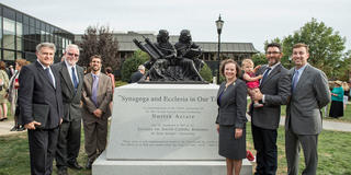 Joshua Koffman and IJCR members in front of the 'Synagoga and Ecclesia In Our Time' statue at Saint Joseph's University