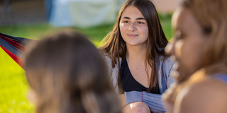 Girl student with college peers