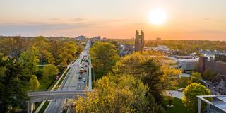 Aerial view of Saint Joseph's University campus at sunset looking down City Avenue with Barbelin tower in the background