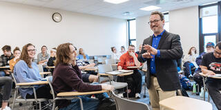 theology faculty professor teaching inside a classroom