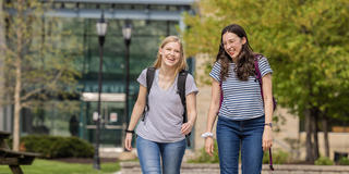 Two undergraduate students by Saint Joseph's Student Center.