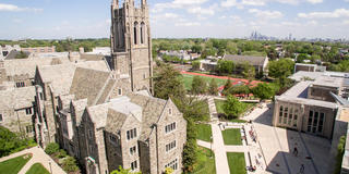 Aerial view of Saint Joseph's University campus with Philadelphia skyline in the background