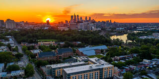 Aerial view of the University of the Sciences campus with Philadelphia skyline in the background.