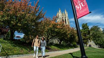 Saint Jospeh's students walking outdoors in fall weather