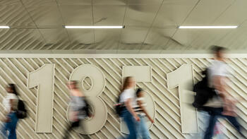 Students walking in Post Cross tunnel