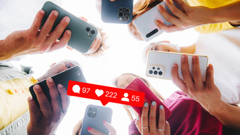 Photo of people holding their phones in a circle with a notification from social media