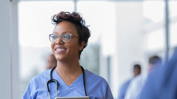 health care worker with a tablet