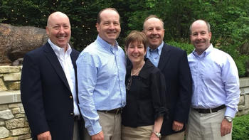The Meehan family standing outside smiling for the photo