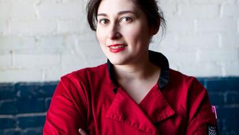 Kate McAleer, dressed in a red chef's coat.