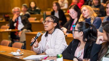Student asks a question at LEAD seminar