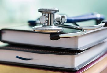 stethoscope on top of books