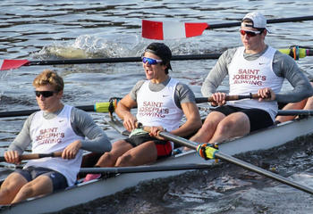 Members of the Saint Joseph's men's rowing team rowing on the water