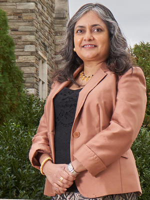 woman wearing a pink blazer